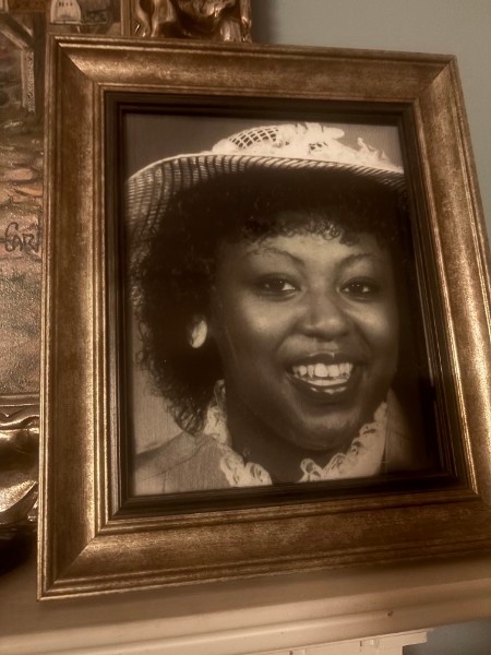 Lovely B. Thomas smiling in a family photograph